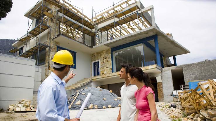Representative photo of an engineer explaining construction work to clients on site